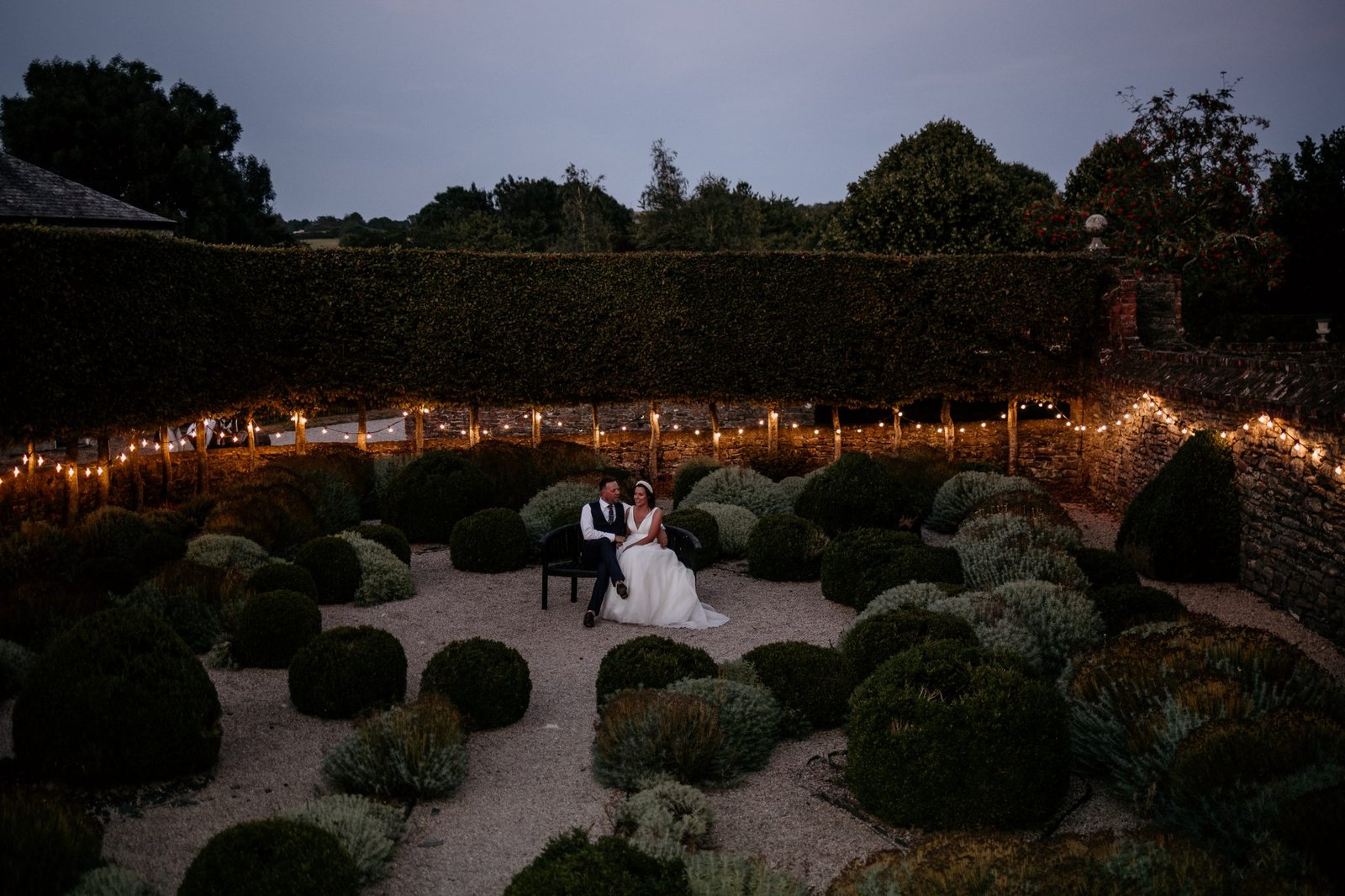 wedding couple sat in the trees