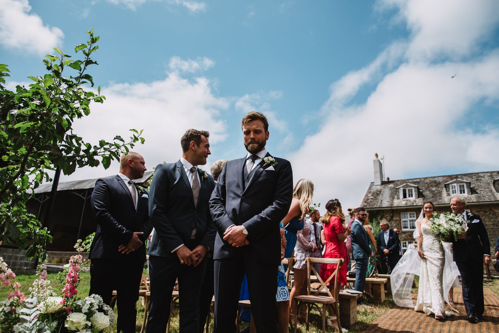 groom cant look at bride coming down the aisle