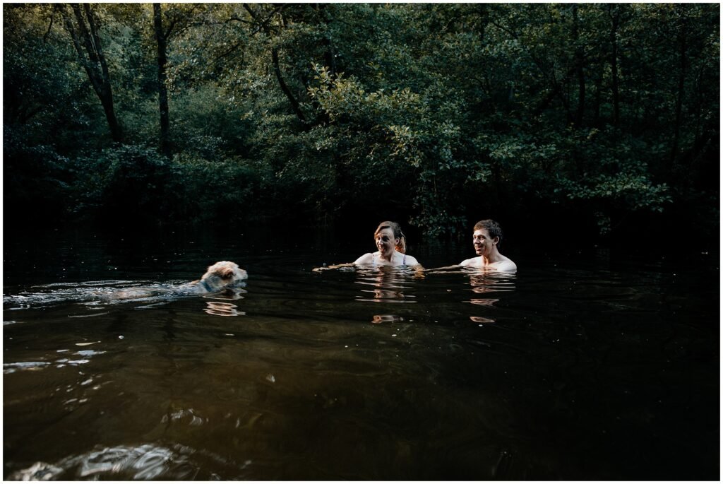 wild swim shoot with couple and dog