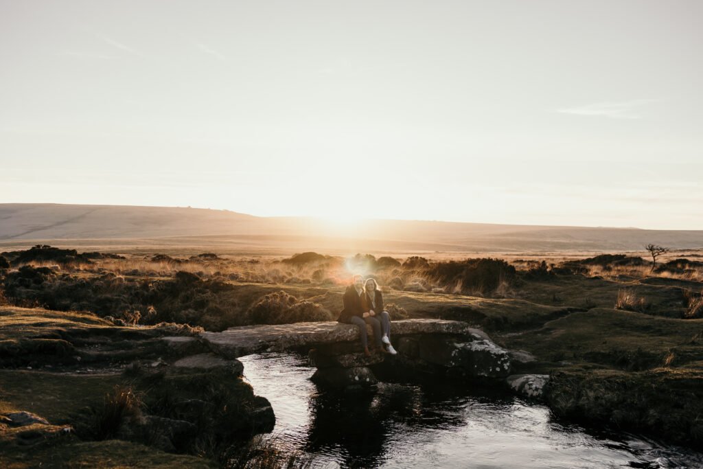 couple on a clapper bridge Dartmoor