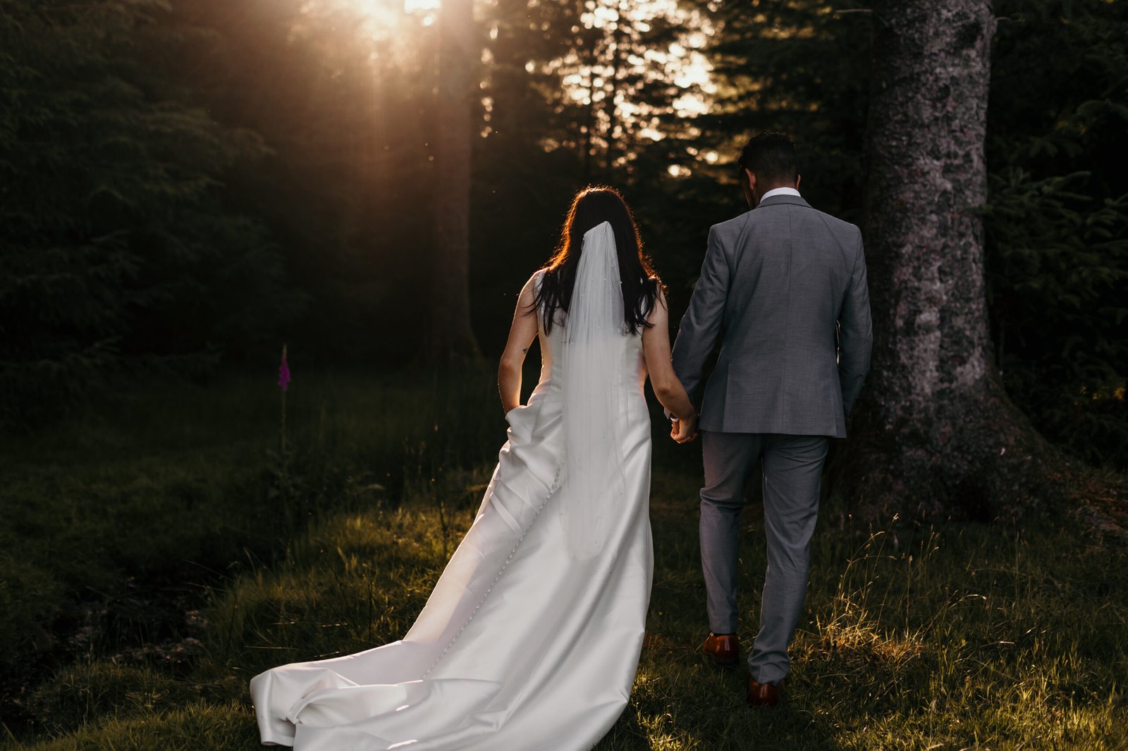 couple walking into the forest